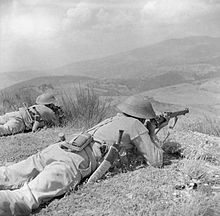 Gurkhas of the 4th Indian Division keep watch on enemy positions in Alpi di Catenaia from high ground on Monte Castiglione, 29 July 1944. The British Army in Italy 1944 NA17494.jpg