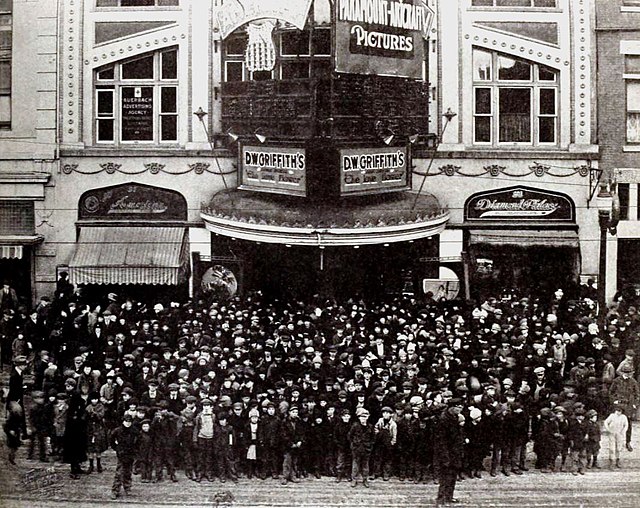 Patrons at a matinee of The Phantom Foe at the American Theater, December 25, 1920