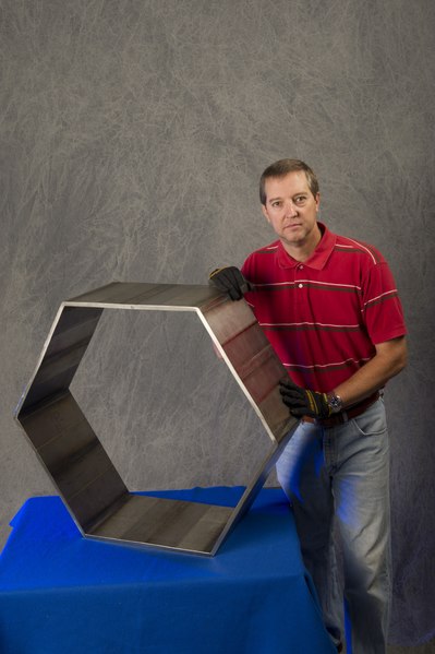 File:Thermal stir welding - André Paseur (Weld Technician, Jacobs Ests GroupErc) displays a hexagon that was fabricated from stir welded plates of 6Al-4V titanium (ELI) using thermal stir welding (NASA 1001623).tif