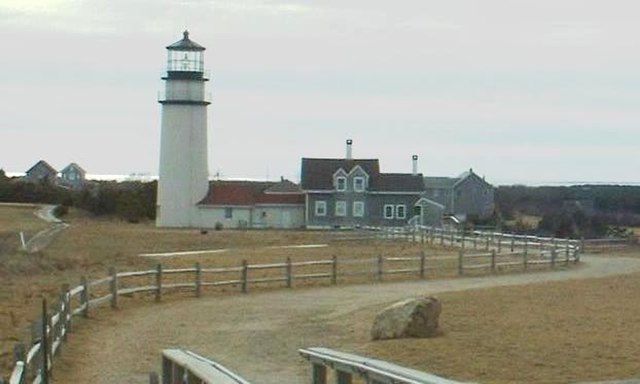 Highland Light. The original site is marked by a boulder in the foreground.
