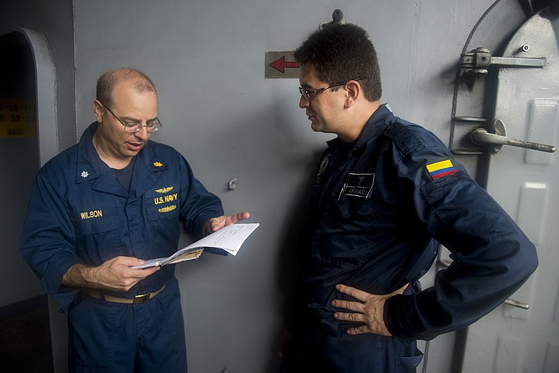 File:U.S. Navy Cmdr. Charles Wilson, left, and Colombian Navy Lt. Hernan Castro discuss medications during a medical meeting aboard the amphibious dock landing ship USS Pearl Harbor (LSD 52) in the Pacific Ocean 130531-N-WD757-085.jpg