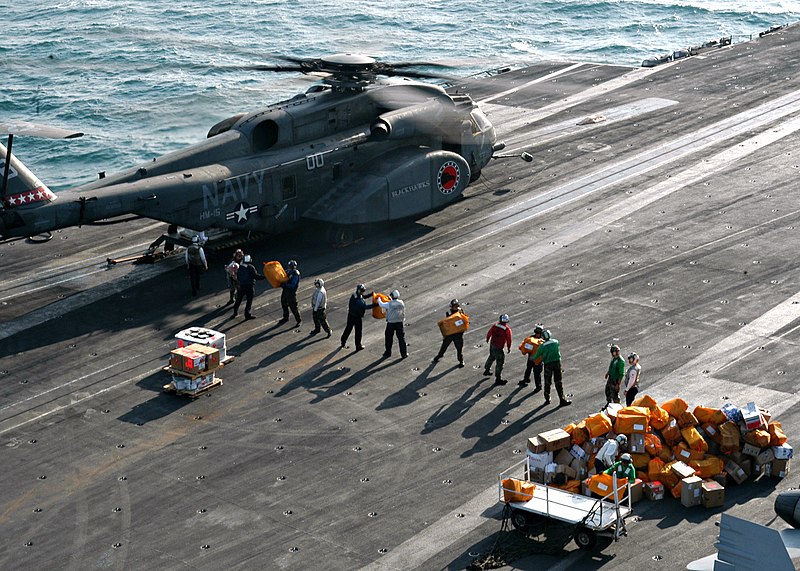 File:US Navy 040102-N-9742R-001 Personnel from the Air Transport Office, Post Office, and Supply Department unload mail and cargo from a MH-53E Sea Dragon assigned to the Blackhawks of Helicopter Mine Countermeasures Squadron One Fi.jpg