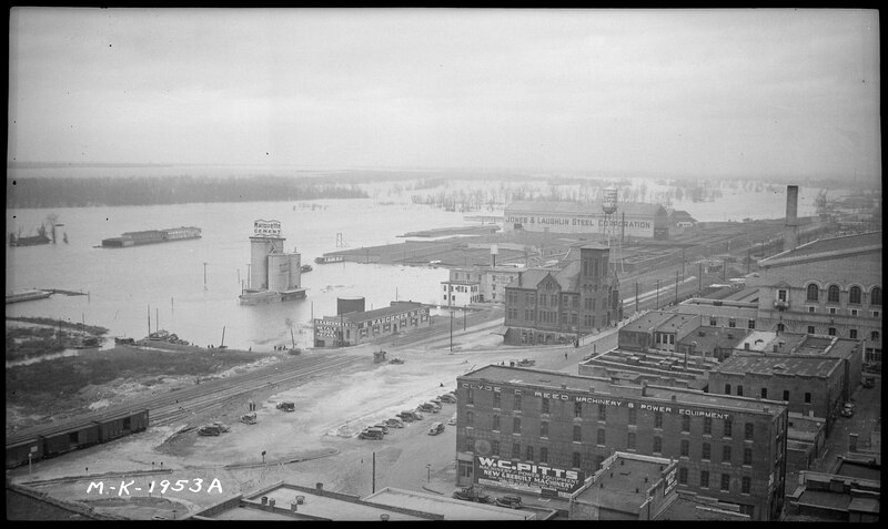 File:Waterfront at flood stage, businesses shown are Marquette Cement, S. Karchmer & Company, Clyde C. Reed Machinery... - NARA - 279848.tif