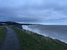 Waves attacking a revetment in County Wicklow, Ireland. Waves on a revetment on the east coast of Ireland.jpg