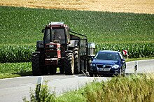 A motorist passing a slow-moving tractor Uberholvorgang - Case-IH 1255XL und VW Passat Variant.JPG