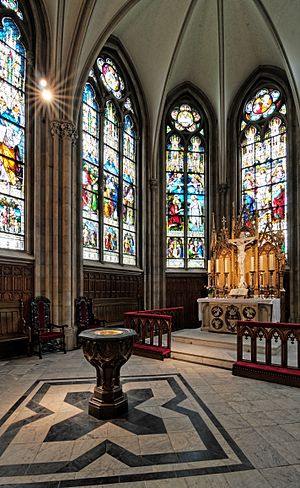 Schwerin Castle Church, baptismal font, altar and stained glass windows in the choir