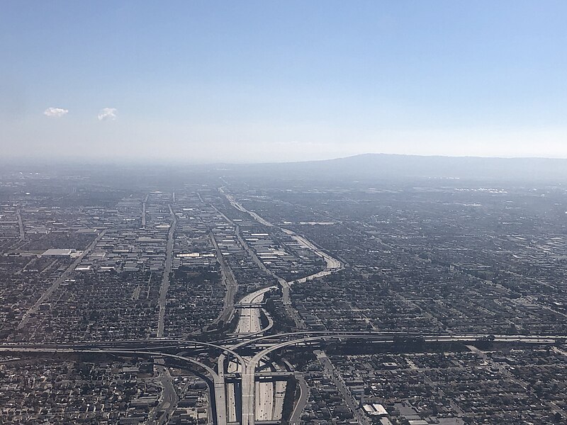 File:2021-10-05 14 22 10 View south across southern Los Angeles, California towards the interchange of Interstate 105 and Interstate 110 from an airplane heading toward Los Angeles International Airport.jpg