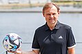 * Nomination: Women Soccer, German national team, Media Day: Bjørn Gulden (CEO Adidas, former player) with ball. By --Stepro 22:17, 28 July 2023 (UTC) * Review Fine for me if you remove the purple CA --Poco a poco 09:36, 29 July 2023 (UTC)