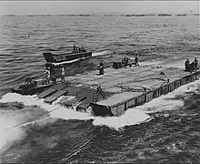 70th Naval Construction Battalion Seabees operating a 6 x 20 barge 70th Naval Construction Battalion Seabees operating a 6 x 20 barge.jpg