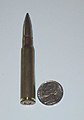 8mm Mauser cartridge next to a United States nickel