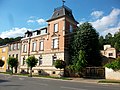 Residential and administrative building of a factory, with side fencing