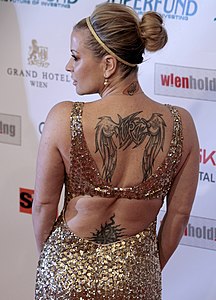 A singer with a back tattoo