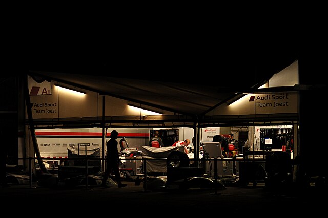 The Joest Racing team at work on their cars before dawn for the 2012 12 Hours of Sebring.
