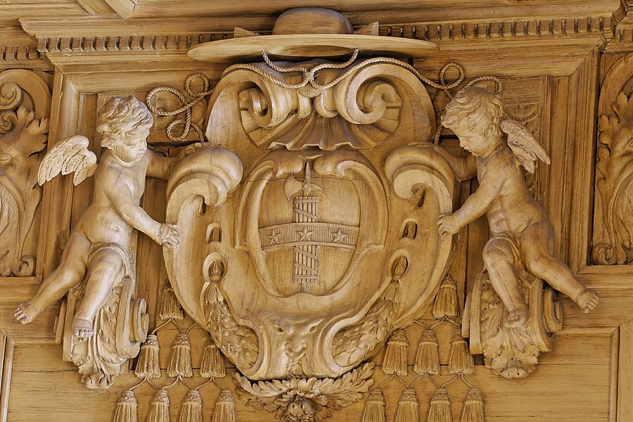 Carved coat of arms of Mazarin on a bookcase in the Bibliothèque Mazarine in Paris