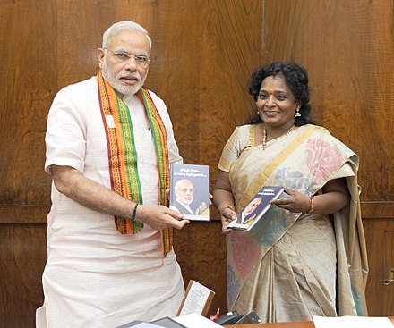 Soundararajan presenting books to Prime Minister Narendra Modi