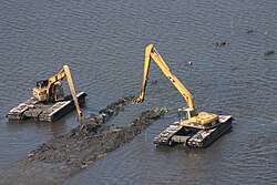 Building duck wing terraces with amphibious excavators Building duck wing terraces with heavy vehicles.jpg