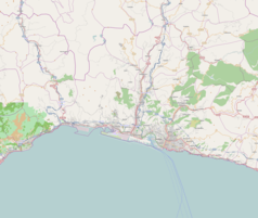 Mapa konturowa Genui, blisko centrum na dole znajduje się punkt z opisem „Uniwersytet Genueński”