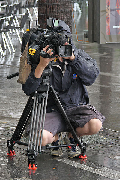 10 News First cameraman filming a traffic piece in Sydney by Vic Lorusso