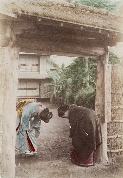 Women bowing in Japan (c. 1880)