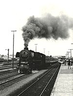 DB Class "012" 4-6-2 No.012 063 pulls a passenger train from Rheine Hbf on a Norddeich - Munster express in 1972