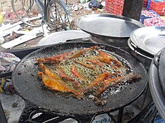 Fishes fried in Dosai pan.JPG