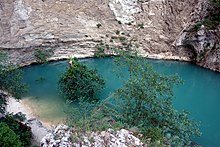 The Fontaine de Vaucluse is the source of the Sorgue. It is characterised by an upward movement of water from the depth of over 315 metres (1,033 ft). Fontaine de Vaucluse en crue.jpg