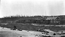 Grand Trunk Pacific boxcars and gondola in Lovett, Alberta, about 1915. Grand Trunk Pacific Boxcars in Lovett AB.jpg