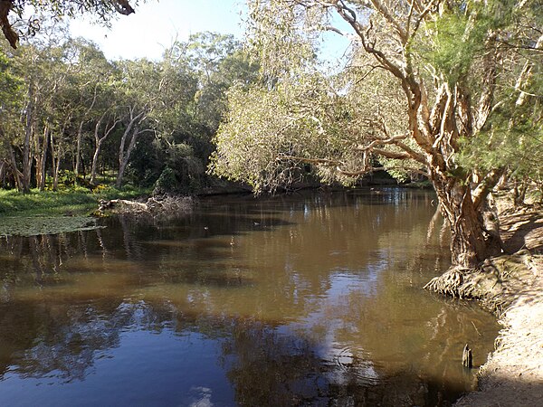 Hilliards Creek, flowing from Moreton Bay, separating the suburbs of Wellington Point (left) and Ormiston (right)