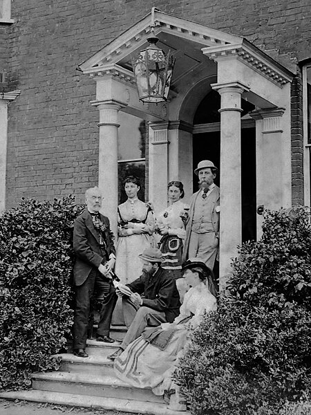 Group portrait in the porch at Gads Hill Place, H.F. Chorley, Kate Dickens, Mamie Dickens, Charles Dickens, C.A. Collins and Georgina Hogarth