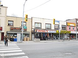 View of Eglinton Avenue West north of Oakwood Avenue; some of the storefronts are replaced with an entrance to Oakwood station of Line 5 Eglinton
