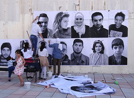 Irbid, Jordan, "We are Arabs. We are Humans". Inside Out is a global participatory art project, initiated by the French photographer JR, an example of Street art