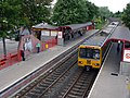 The view north west across the station from the footbridge; Metrocar No. 4018 is at the front of a train arriving in Platform 1, en route to South Shields 16 July 2010