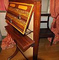 ;Bookcase, and cue stand in the 1872 Billiard Room