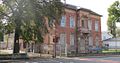 Factory with director's villa (and previously attached three-storey production building) and fencing