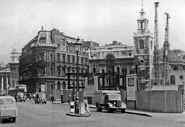 Queen Victoria Street's eastern end pictured in 1955. The church of St Stephen Walbrook (right) is undergoing repair after damage in the Blitz. The Ba