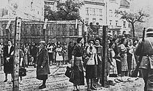 Women behind the barbed wire fence of the Lwow Ghetto in occupied Poland, Spring 1942 Lwow Ghetto (spring 1942).jpg