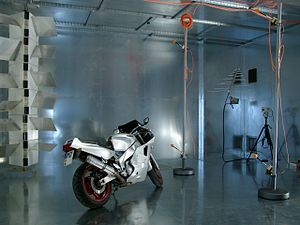 A look inside the (large) Reverberation Chamber at the Otto-von-Guericke-University Magdeburg, Germany. On the left side is the vertical Mode Stirrer (or Tuner), that changes the electromagnetic boundaries to ensure a (statistically) homogeneous field distribution. Magdeburg-reverberation chamber.jpg