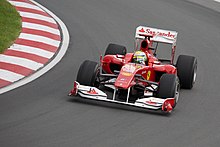 Ferrari's Fernando Alonso from Spain, right, drives his car in between the  pack during the European Formula One Grand Prix at Valencia street circuit,  Spain, Sunday, June 24, 2012. The race takes