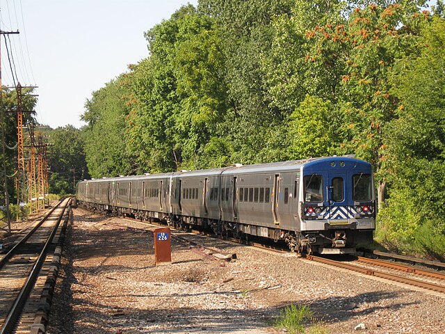 Train No. 645 leaves the White Plains station, northbound to Southeast.