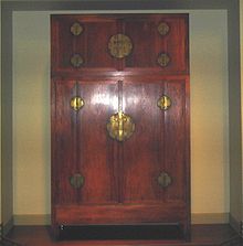 A Chinese Ming Dynasty compound wardrobe made of huanghuali rosewood, latter half of the 16th century. Ming Dynasty Wardrobe.jpg