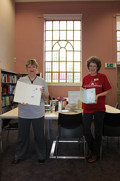 File:Monmouth librarians with QRpedia codes in books.JPG