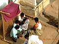 Villagers reading news paper