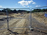 Footpath 16B passing through the construction site of a new link road being built north of Sidley.