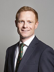 Official portrait of Robbie Moore MP crop 2.jpg