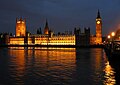The Palace of Westminster at night seen from the south bank of the River Thames, photographed by Andrew Dunn, from the United Kingdom (user "Solipsist")