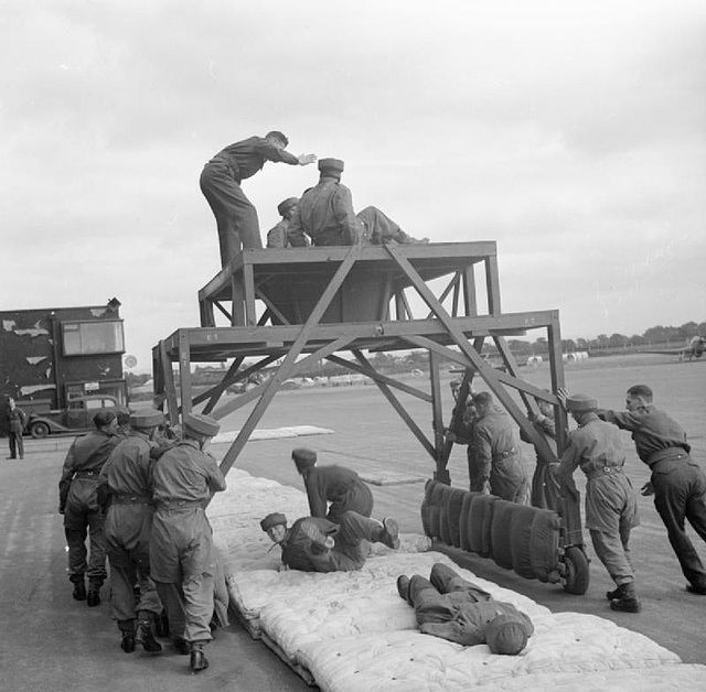Recruits of the 6th (Royal Welch) Parachute Battalion being taught how to drop through a moving aperture, August 1942.