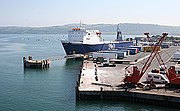 Freight ship docking at the port.