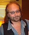 Reeves Gabrels played guitars in Tin Machine and continued to play guitars for Bowie throughout the 1990s.