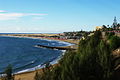 Vista da promenade junto à praia com as dunas ao fundo