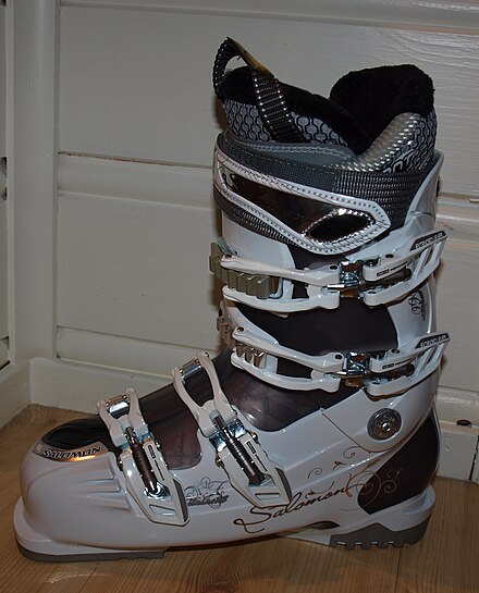The extensions at the toe and heel of this ski boot produce flanges used to clip into the ski bindings.